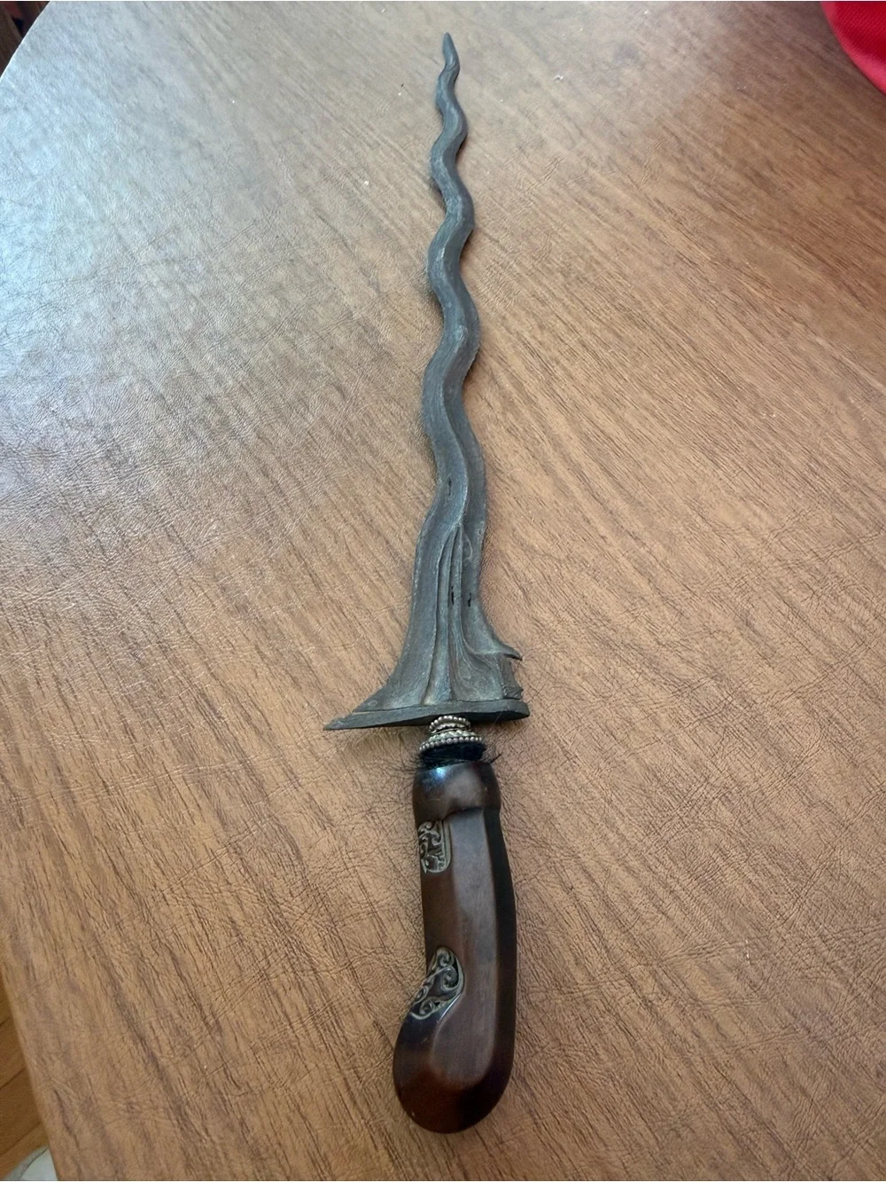 Antique Keris a traditional asymmetrical dagger with a wavy blade from Indonesia